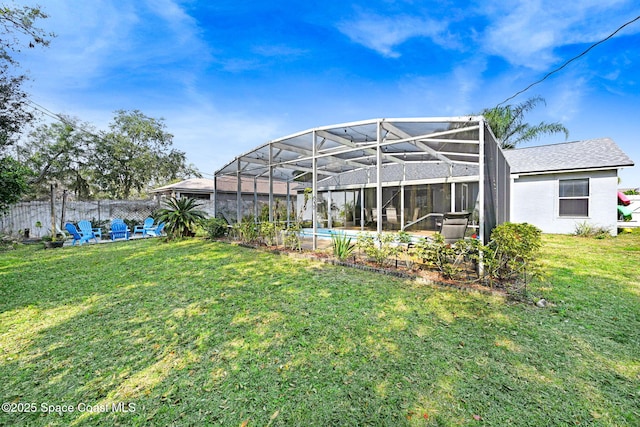 view of yard with a lanai and a patio