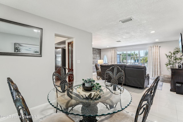 dining room with a textured ceiling