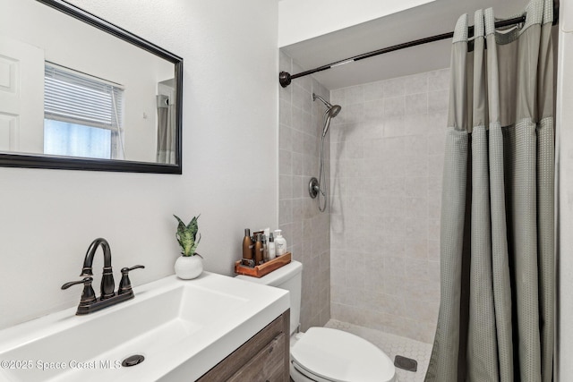 bathroom with vanity, toilet, and a shower with shower curtain