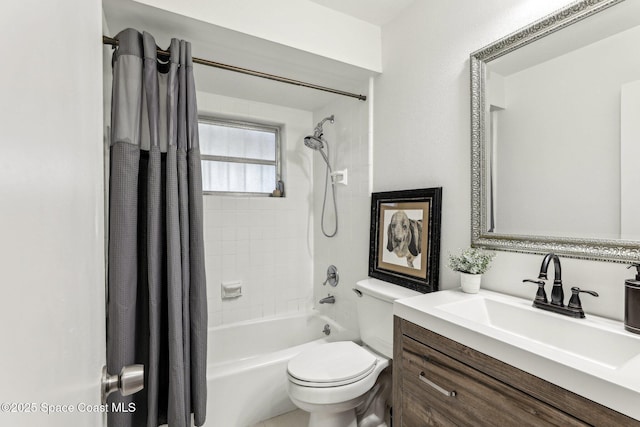 full bathroom featuring vanity, shower / tub combo, and toilet