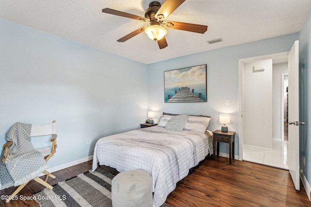 bedroom featuring ceiling fan and dark hardwood / wood-style flooring