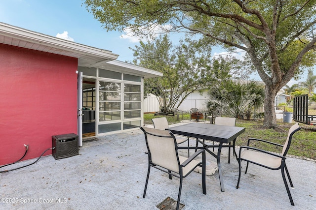 view of patio / terrace with a sunroom