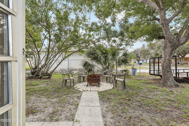 view of yard with a fire pit