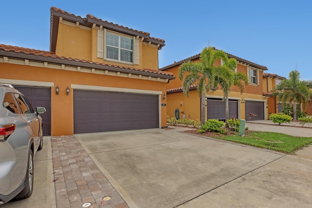 mediterranean / spanish-style house featuring a garage