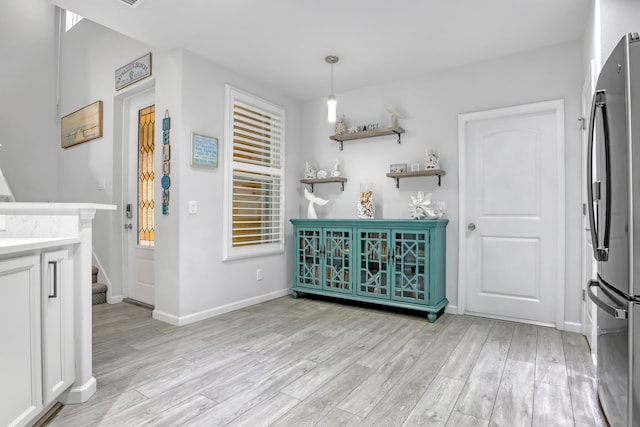 interior space with light hardwood / wood-style floors