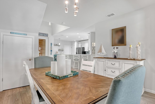 dining room with light hardwood / wood-style floors