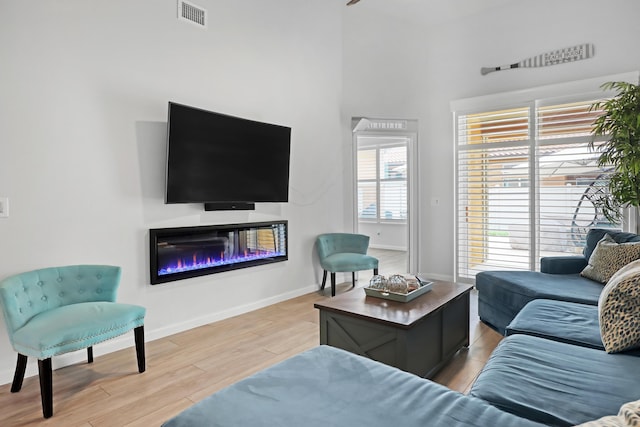 living room with light hardwood / wood-style floors