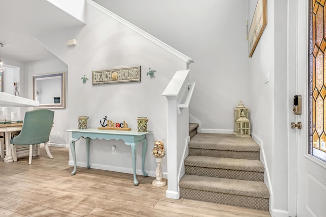 stairs featuring hardwood / wood-style flooring