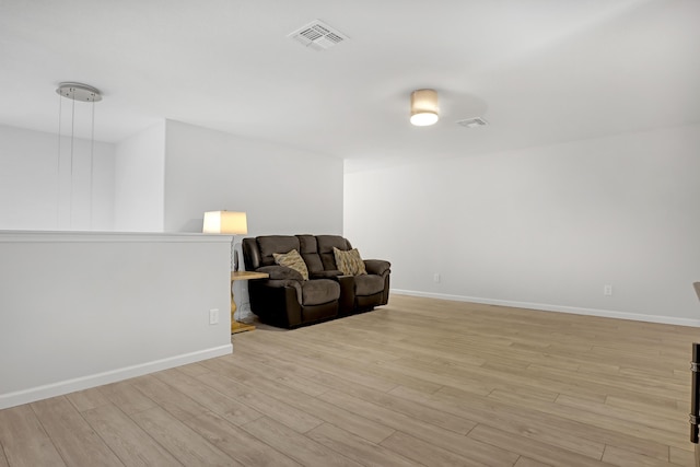 sitting room with light hardwood / wood-style flooring