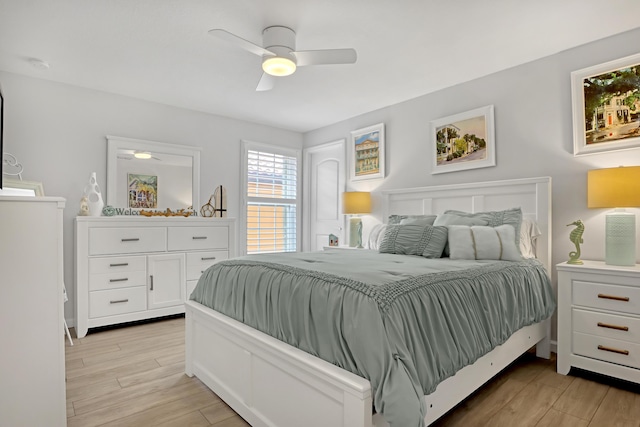 bedroom with ceiling fan and light hardwood / wood-style flooring