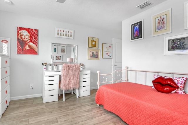 bedroom with light hardwood / wood-style floors