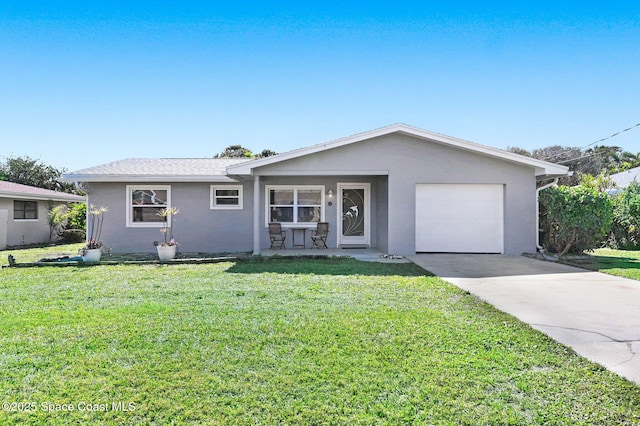 single story home featuring a garage and a front lawn