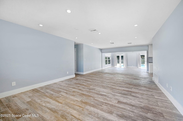 unfurnished living room with light hardwood / wood-style floors