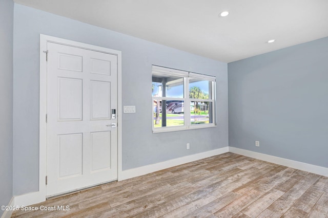 empty room with light hardwood / wood-style floors