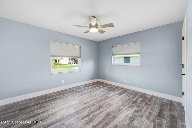 unfurnished room with hardwood / wood-style flooring and ceiling fan