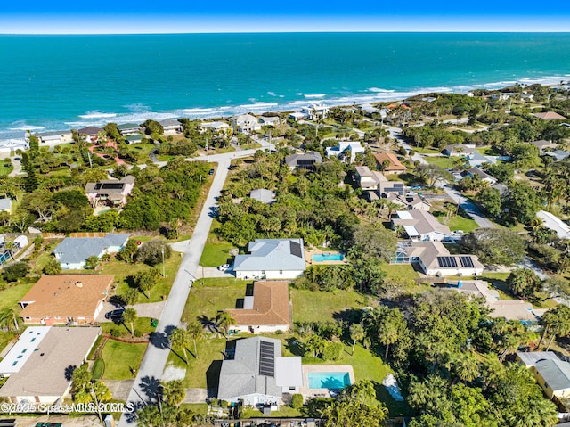 aerial view with a water view and a view of the beach