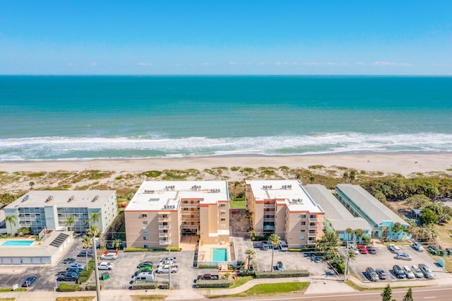 aerial view featuring a view of the beach and a water view