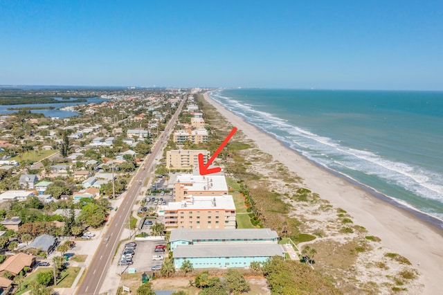 aerial view with a view of the beach and a water view