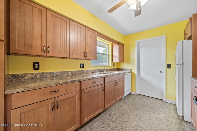 kitchen with sink, white appliances, and ceiling fan