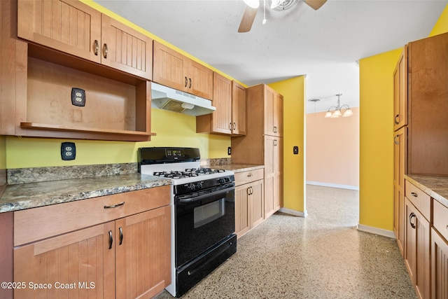 kitchen featuring black gas stove and ceiling fan with notable chandelier