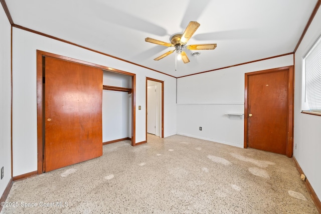 unfurnished bedroom with crown molding, ceiling fan, and a closet