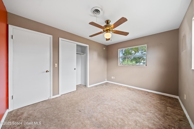 unfurnished bedroom with carpet flooring, ceiling fan, and a closet