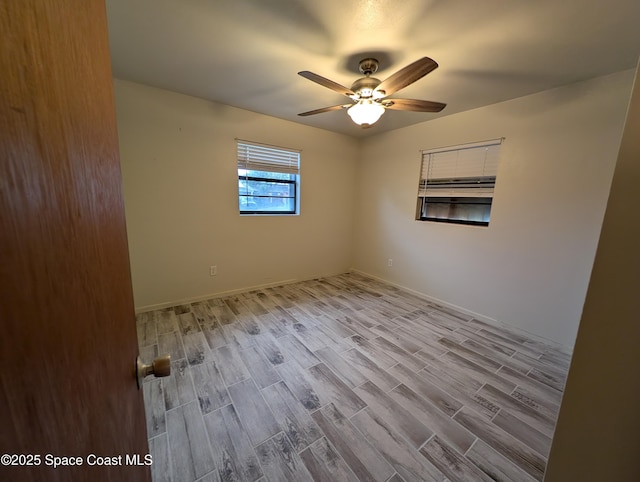 unfurnished room featuring ceiling fan and light hardwood / wood-style floors