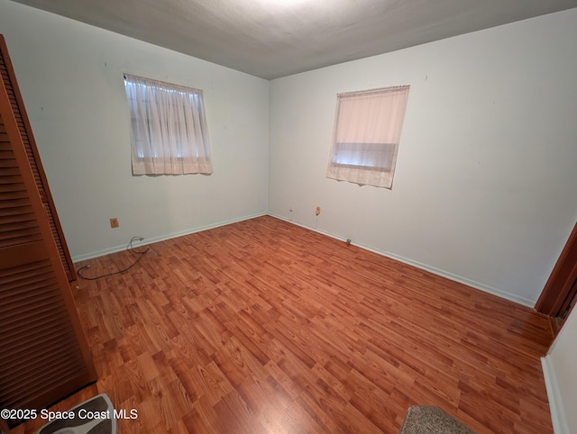 empty room featuring light hardwood / wood-style floors