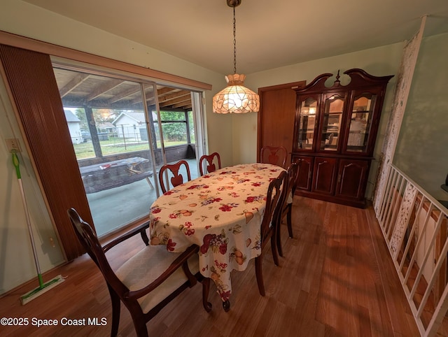 dining area with dark wood-type flooring