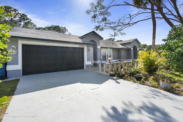 single story home featuring a garage