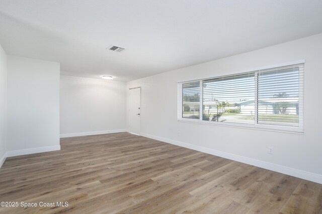 empty room featuring wood-type flooring