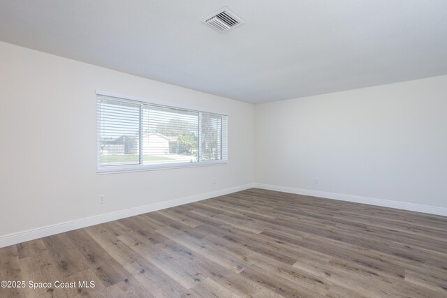 empty room featuring hardwood / wood-style flooring