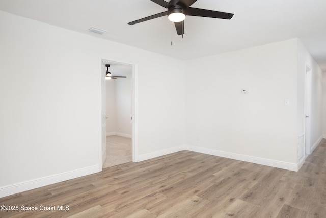 spare room featuring light wood-type flooring