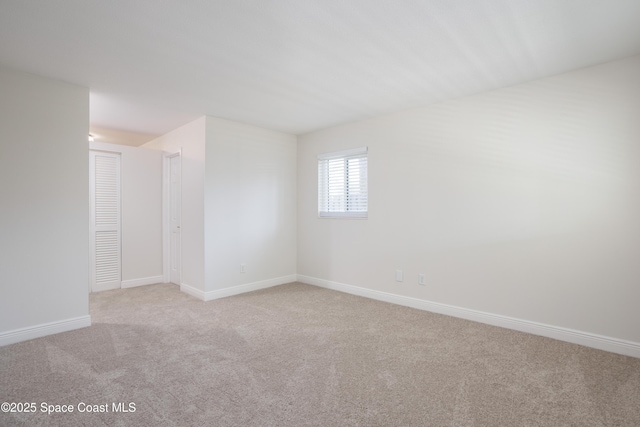 empty room with light colored carpet