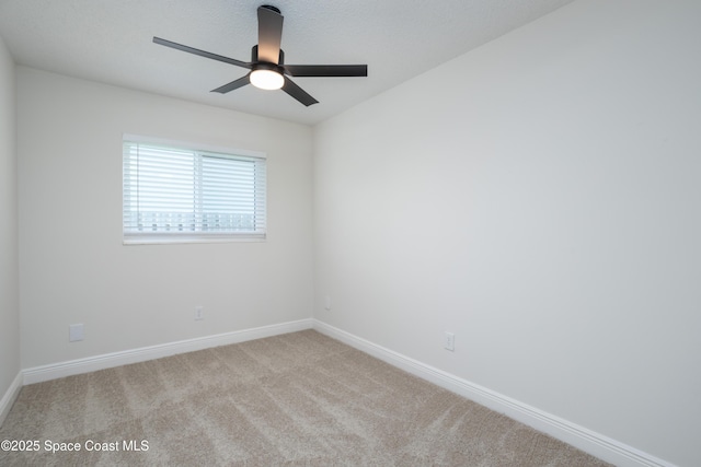 unfurnished room with light carpet and ceiling fan