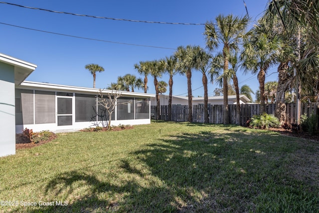 view of yard featuring a sunroom