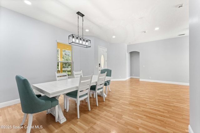 dining space featuring light wood-type flooring