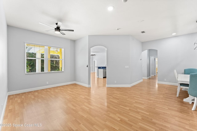 unfurnished living room featuring light hardwood / wood-style floors and ceiling fan