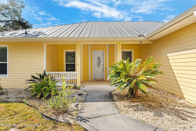 doorway to property featuring a porch