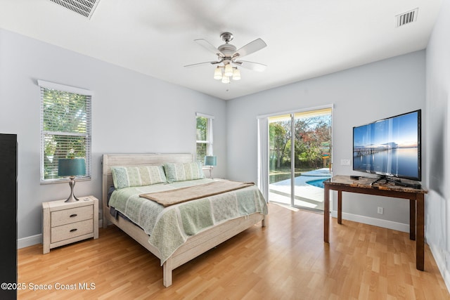 bedroom featuring hardwood / wood-style flooring, access to exterior, and ceiling fan