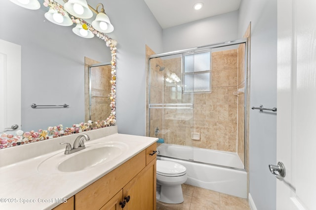 full bathroom with tile patterned flooring, vanity, toilet, and combined bath / shower with glass door