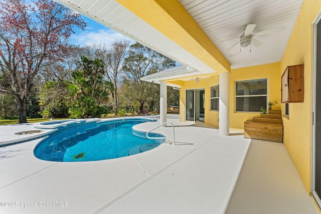 view of swimming pool with an in ground hot tub, ceiling fan, and a patio