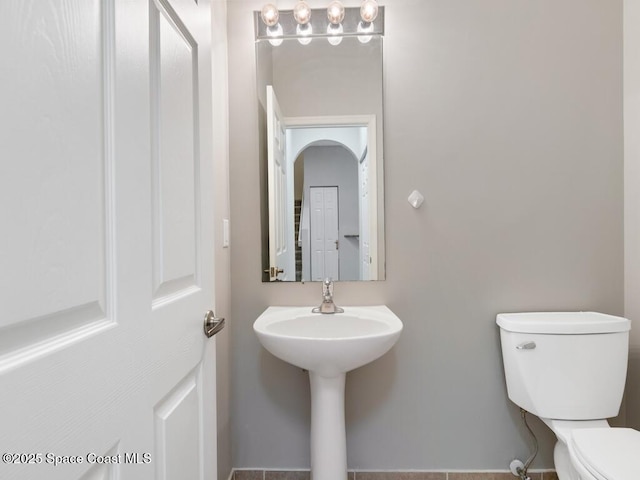 bathroom featuring toilet