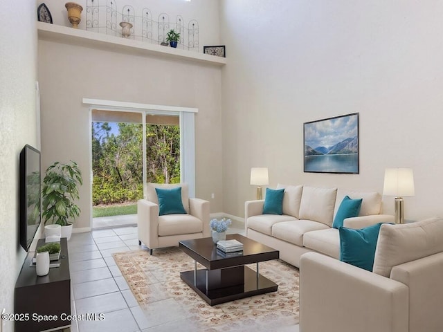 living room featuring tile patterned flooring and a high ceiling