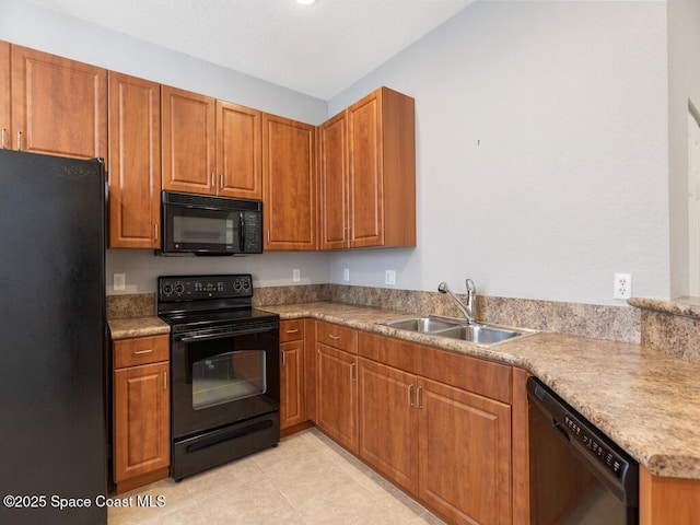 kitchen with light tile patterned floors, sink, and black appliances