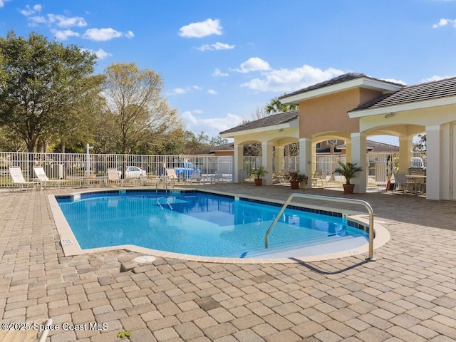 view of swimming pool with a patio