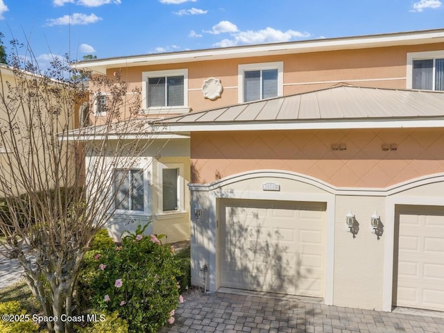 view of front of property with a garage