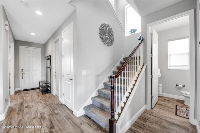 stairway featuring hardwood / wood-style floors