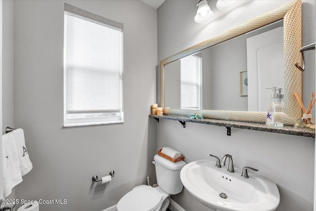 bathroom with sink and toilet