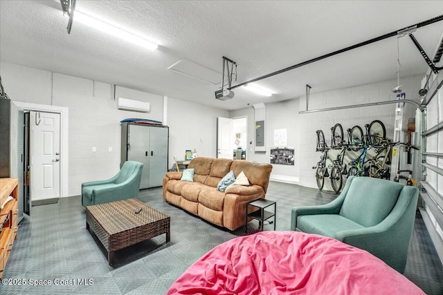 living room featuring electric panel, a wall unit AC, and a textured ceiling